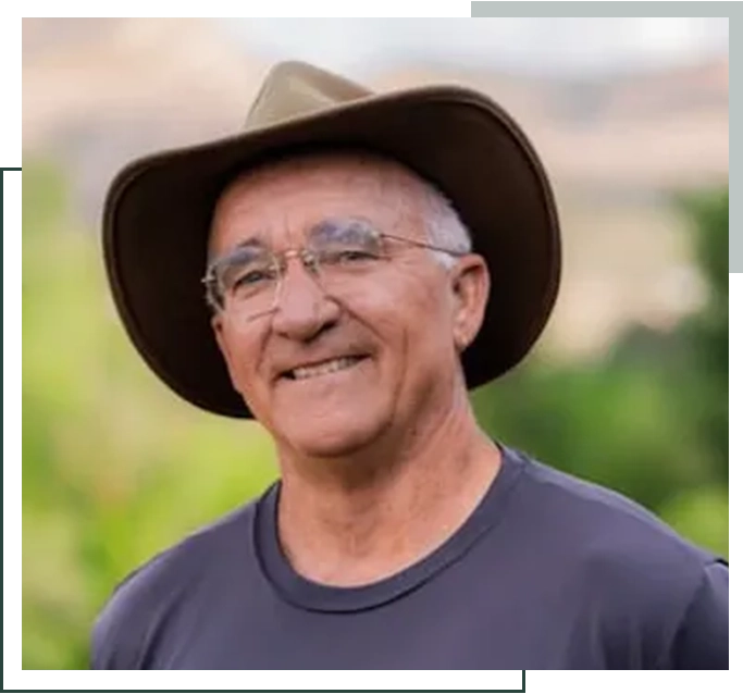 A man wearing glasses and a hat.
