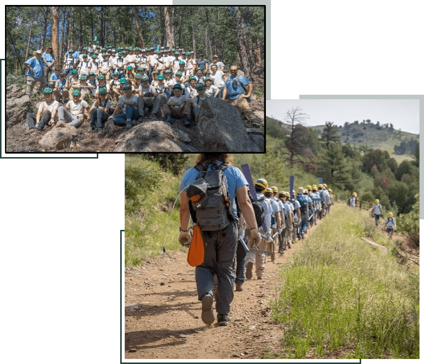 A group of people walking down a trail.
